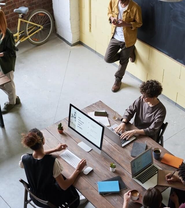 Professionals collaborating during an event session